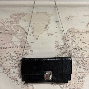 Sleek Black Clutch with Silver Accent